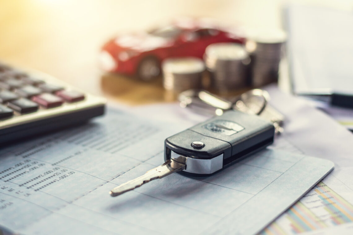 image of car key and financial statement